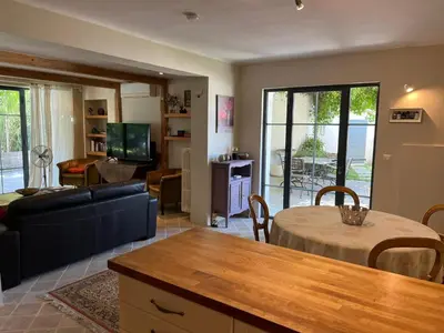 a living room with a couch and a table at The Willow Tree in Le Thor