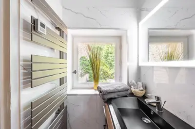 a kitchen with a sink and a window at La Pastorale in Lagnes