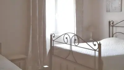 a bedroom with a bed and a window at Charmante villa à Dauphin avec piscine privée et jardin in Dauphin