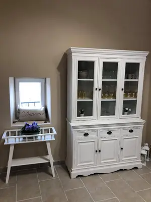 a white cabinet in a room with a table at Provence Luberon Bonnieux Location Gite Chez Basile in Bonnieux