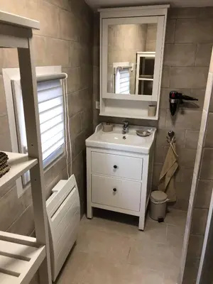a bathroom with a white sink and a mirror at Provence Luberon Bonnieux Location Gite Chez Basile in Bonnieux
