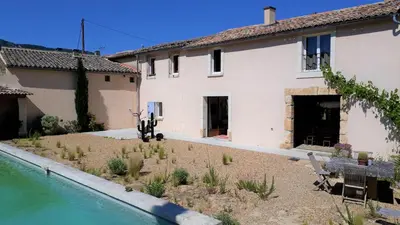 a house with a yard with a swimming pool at Mas du Figuier Oppede Luberon in Oppède