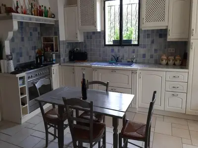 a kitchen with a table and chairs and a sink at Relaxing Provence Hideaway in Carpentras