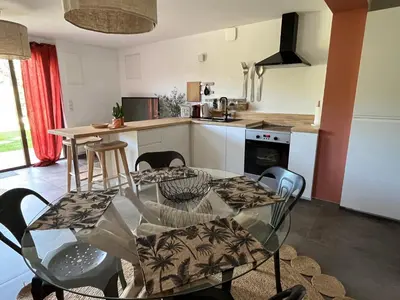 a kitchen and dining room with a table and chairs at Domaine Hestia in Robion en Luberon