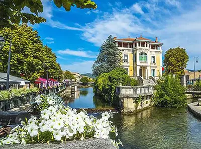 a building next to a river in front of a building at 