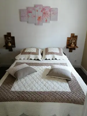 a bedroom with two beds with pillows on them at La perle des Alpilles Résidence les MYRTILLES in Eyguières