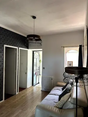 a living room with a couch and a table at Ocra Pure in Roussillon