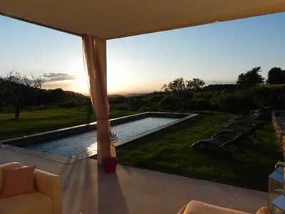 a view of a pool from the patio of a house at Là Mésange de Venasque in Venasque