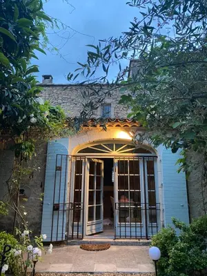 an entrance to a house with a gate at Le mas jasmins in Ménerbes