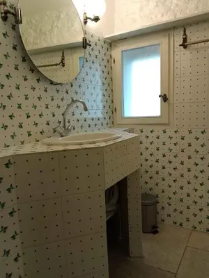 a bathroom with a sink and a mirror at Santonne in Apt