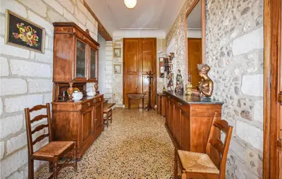 a kitchen with blue cabinets and a black and white checkered floor at 2 Bedroom Beautiful Home In Avignon in Avignon