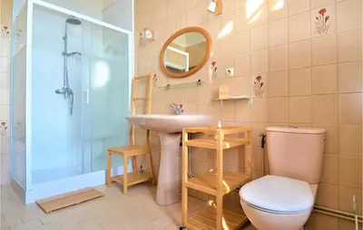 a bathroom with a sink and a toilet at 2 Bedroom Beautiful Home In Avignon in Avignon