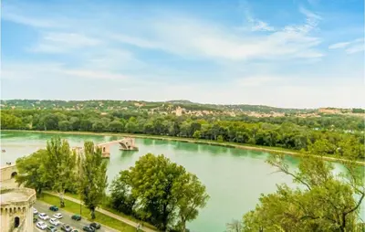 a snow covered hill with a lighthouse on top of it at 2 Bedroom Beautiful Home In Avignon in Avignon