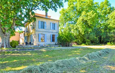 an old house with trees in front of it at 2 Bedroom Beautiful Home In Avignon in Avignon