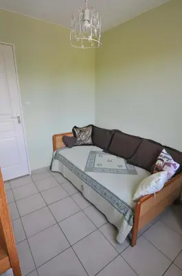 a bedroom with a bed in a room at Gîte de Catherine in Saint-Didier