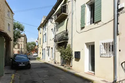 a car parked on the side of a street at Provençal Studio Netflix Appart-hotel-Provence in La Fare-les-Oliviers