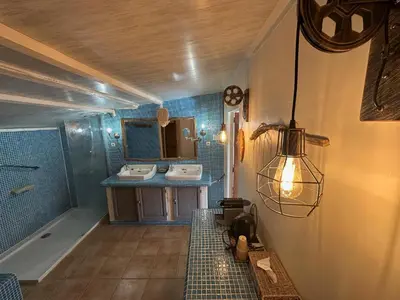 a bedroom with a bed in a room at Mas la Provence in LʼIsle-sur-la-Sorgue