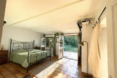 an exterior view of a house with a yard at Mas la Provence in LʼIsle-sur-la-Sorgue