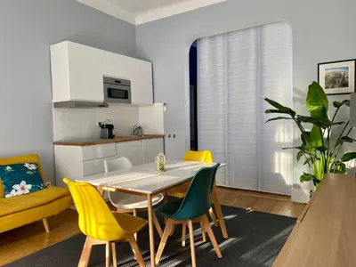 a kitchen and dining room with a table and chairs at Villa Suzanne - Lambesc centre in Lambesc