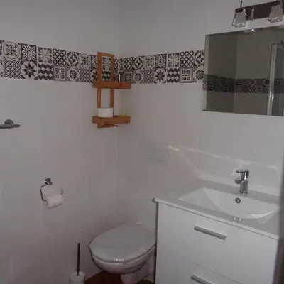 a bathroom with a toilet and a sink and a mirror at Villa Zola in Aix-en-Provence