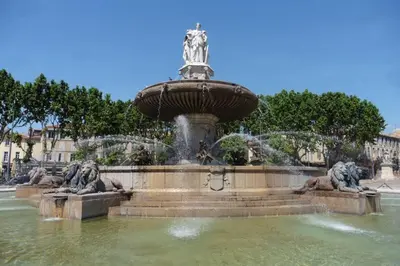 a fountain with two statues in the water at Villa Zola in Aix-en-Provence