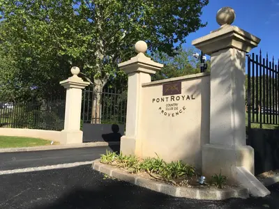 a gate in front of a wrought iron fence at Studio sur le Domaine du Golf de Pont Royal in Mallemort