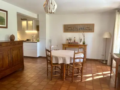 a kitchen with a table and chairs in a room at Chez Suzanne in Bonnieux
