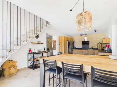 a kitchen and dining room with a large wooden table and chairs at Magnifique Mas Provençal avec Piscine à Eygalières - 19 Couchages, 8 Chambres, Billard, et Plus ! - FR-1-599-3 in Eygalières