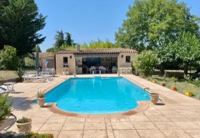 a swimming pool in front of a house at « CARPE DIEM » in Aix-en-Provence