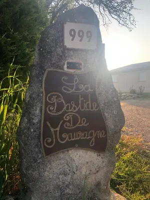 a gate in a garden with a fence at La bastide de Mauragne - Gîte les Iris in Apt