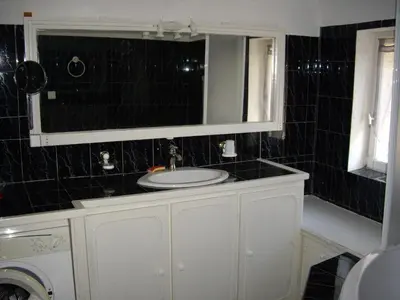 a bathroom with a sink and a mirror at La bastide de Mauragne - Gîte les Iris in Apt