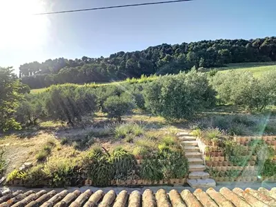 a garden with rocks and plants in a field at LesArnauds in Aix-en-Provence