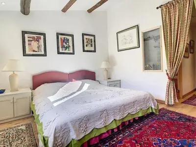 a bedroom with a large bed in a room at LesArnauds in Aix-en-Provence