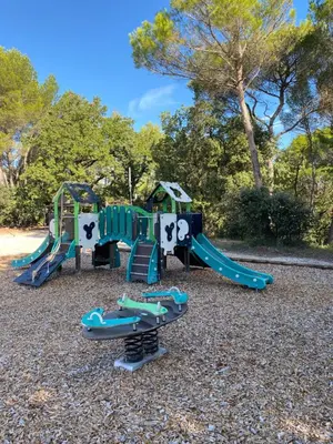 a playground with a slide and a slide at Les Demeures du Ventoux in Aubignan