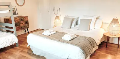 a bedroom with two beds and a bunk bed at La Source in Oppedette