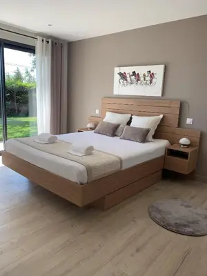 a bedroom with a large bed and a large window at Villa moderne en Provence avec piscine in Carpentras