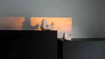 two birds sitting on top of a table at L’Abrico’thym in Apt
