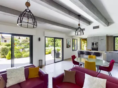 a living room with purple furniture and a table at Villa rénovée à Eygalières avec piscine chauffée - FR-1-599-19 in Eygalières