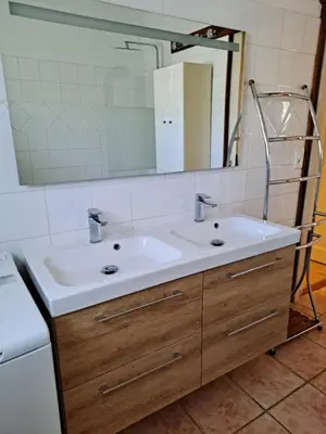 a bathroom with a sink and a mirror at bastide St Joseph in Eyguières