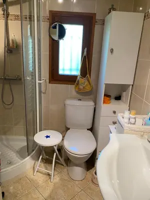 a bathroom with a toilet and a shower and a sink at Maison provençale en campagne à Eguilles in Éguilles