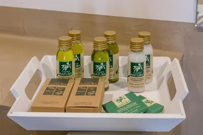 a white tray with five bottles of sauce on it at Villa Domitia Chambre d'Hôtes Luberon in Bonnieux
