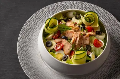 a bowl of food on a plate on a table at La Bastide de Damien, 5 clefs Demeure d'Exception et Table Remarquable dans le guide Teritoria, JACUZZI Privatif, Cuisine étoilée Dominique Frérard in Aix-en-Provence