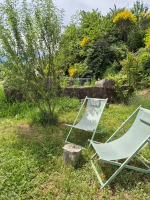 two lawn chairs sitting in the grass at Hébergements insolites - Détente en Luberon in Viens