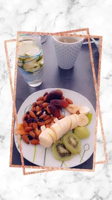 a plate of fruit and vegetables on a table at Les Cigales in Villelaure