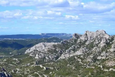 a view of a rocky mountain with a blue sky at Le Jardin des Alpilles in Eyguières