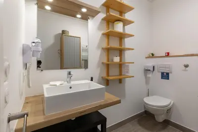 a bathroom with a sink and a toilet at Beau studio Monteux, balcon vue Lac, près de Spirou Provence in Monteux
