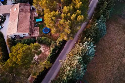 an aerial view of a house on a road at Maison charmante à Aix-en-Provence avec piscine privée in Aix-en-Provence