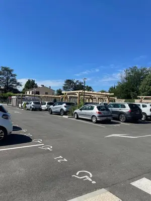 a parking lot with a lot of cars parked at DOMITYS LES TOURMALINES in Carpentras