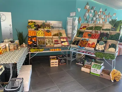 a store filled with lots of fruits and vegetables on display at DOMITYS LES TOURMALINES in Carpentras