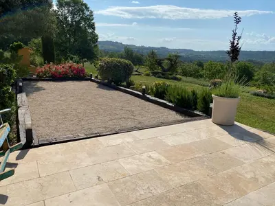 a garden with a patio and a view at Location bastide provencale Luberon in Murs